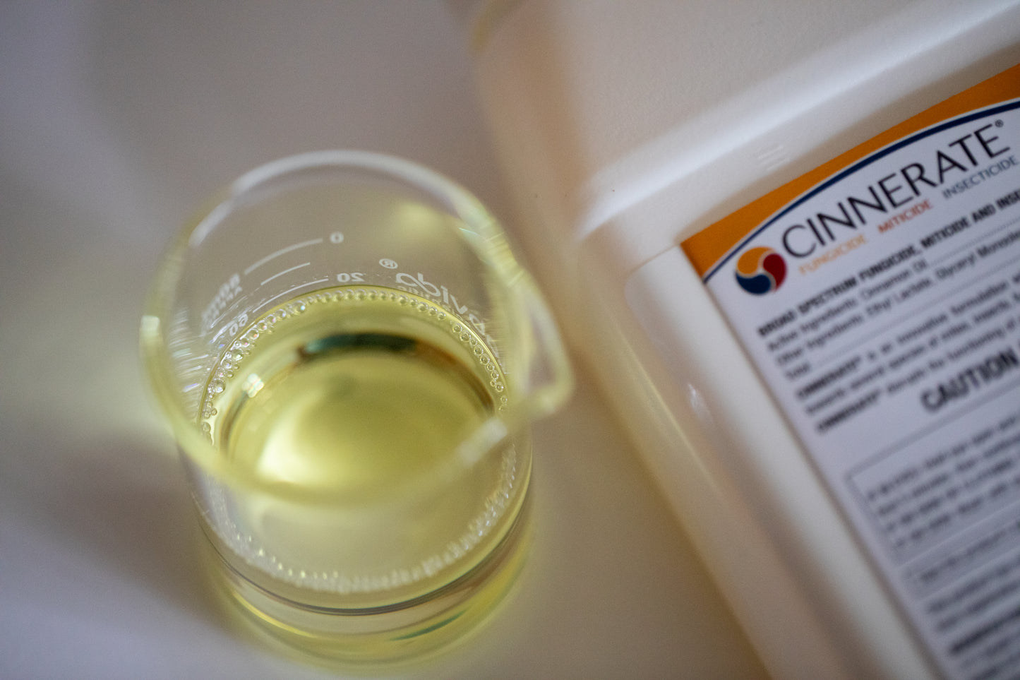Cinnerate® organic insecticide fungicide bactericide pesticide liquid next to quart container
